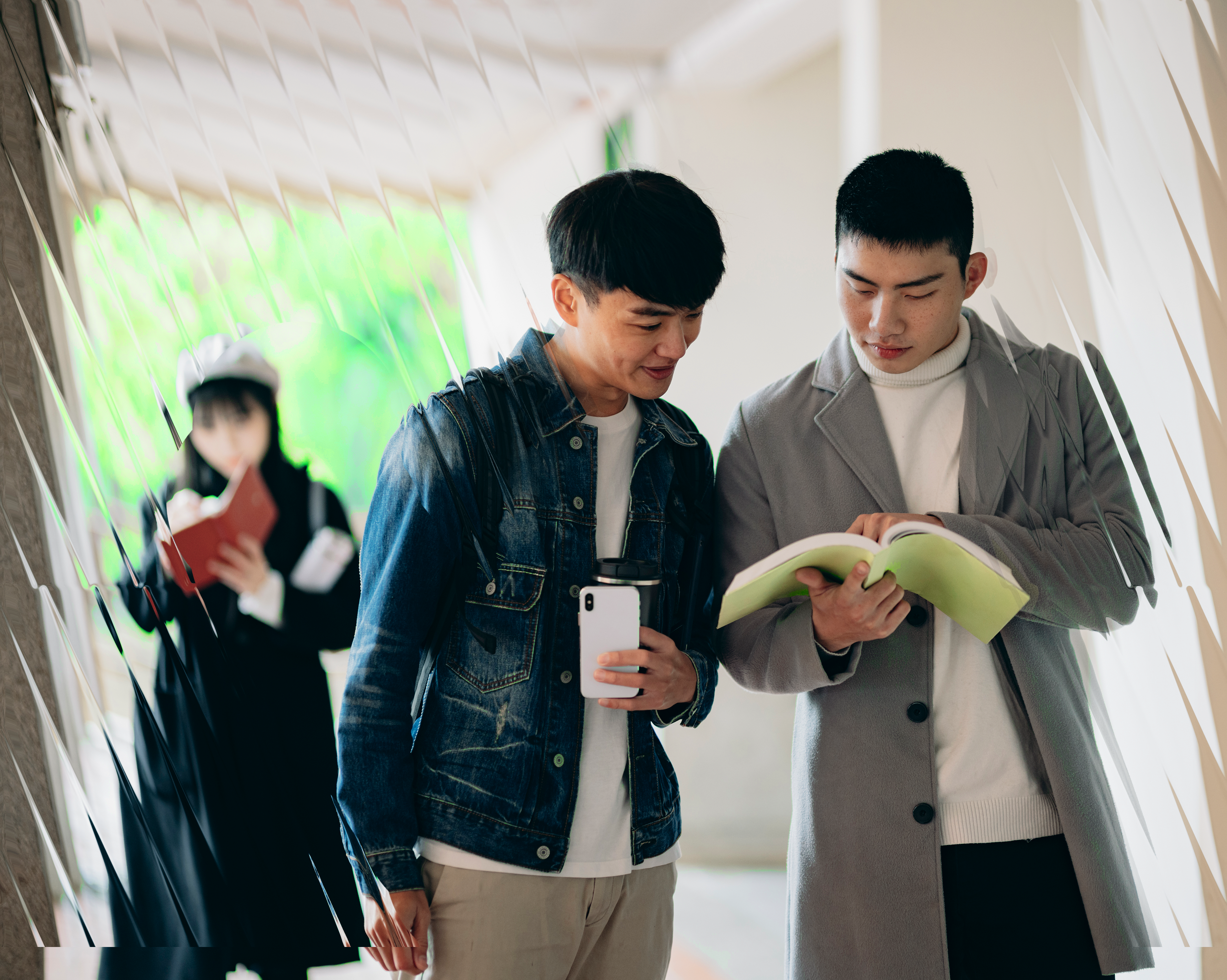 Students looking at book
