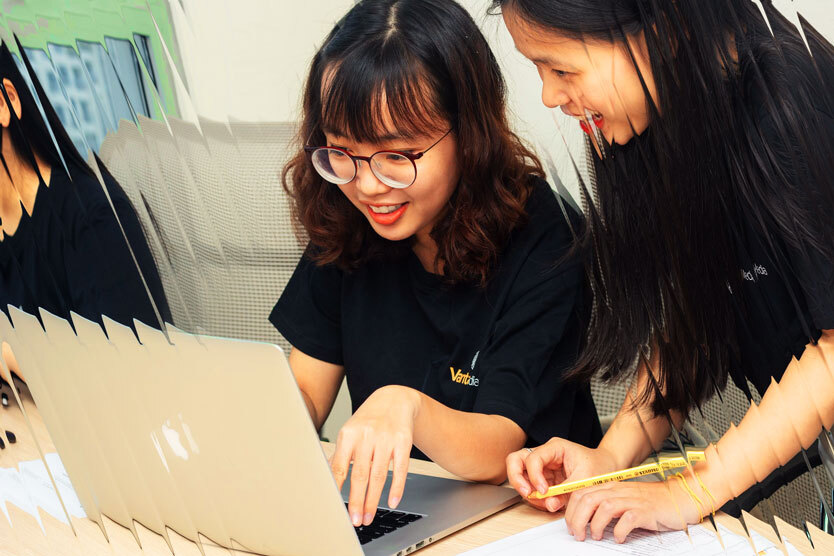 Two students looking at laptop 2